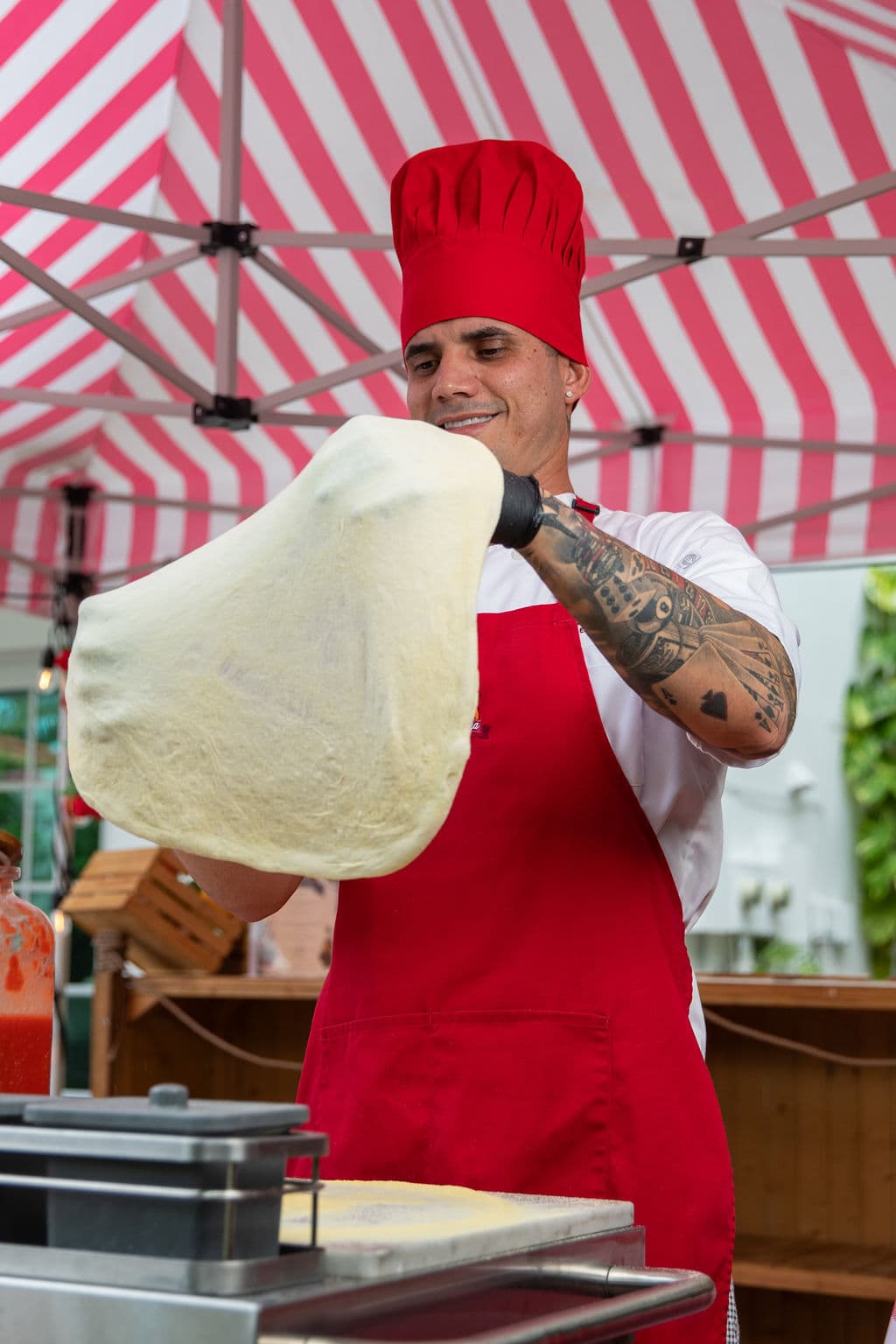 Wood-fired pizza served live at a Miami event